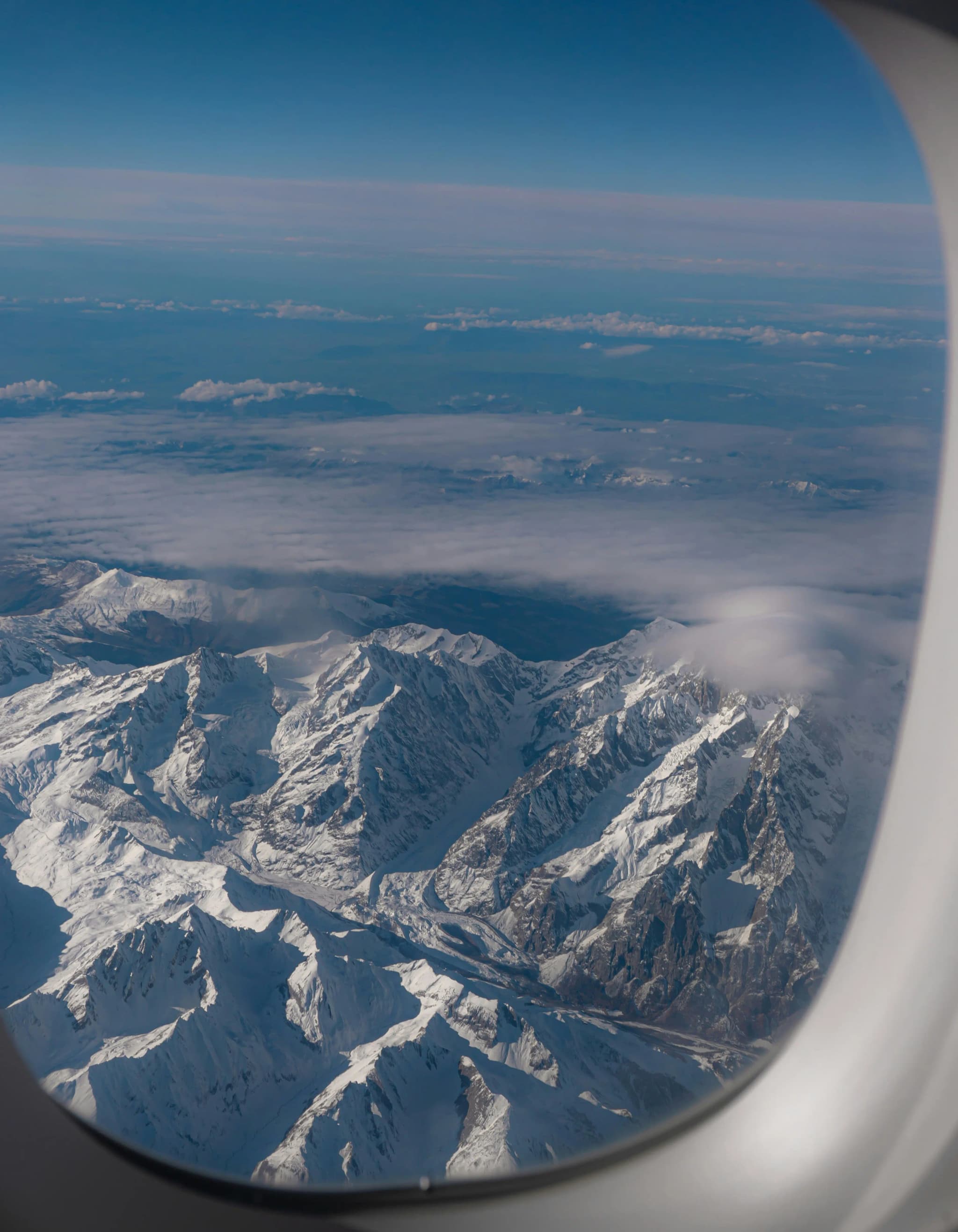 Snowy mountain peaks at sunset